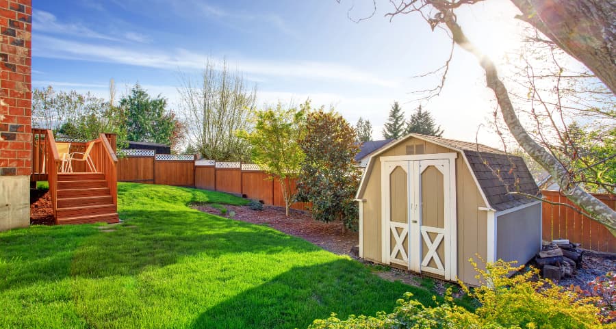 Fenced backyard with storage shed in Greensboro